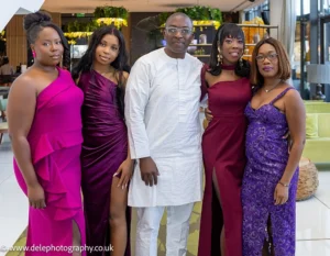 family and friends taking a wedding picture