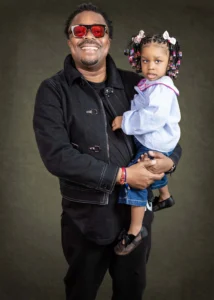 father and daughter smiling